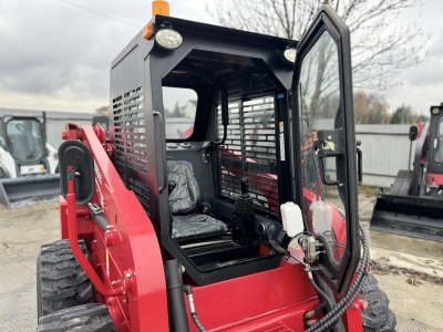 Колесный мини погрузчик с бортовым поворотом QUADTRAC SSL95JMAX. Изображение №13