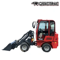 Компактный телескопический мини-погрузчик QUADTRAC WL30T с шарнирно-сочлененной рамой.