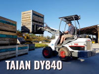 Мини-погрузчик TAIAN DY840 на складе Работа в узких проходах между стеллажами, перемещение грузов и паллет, погрузочно-разгрузочные операции.