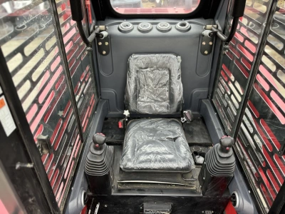 Колесный мини погрузчик с бортовым поворотом QUADTRAC SSL95JMAX. Изображение №12